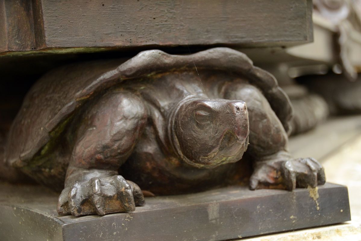 05-5 One Of The Turtles Holding Up A Flagpole Outside New York City Public Library Main Branch